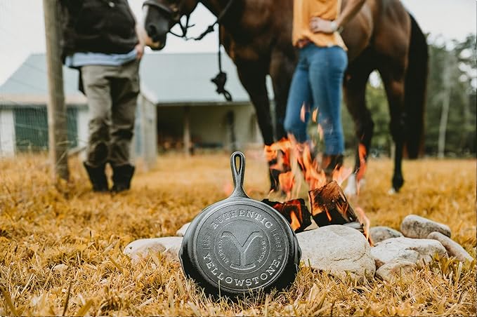 Lodge Pre-Seasoned Yellowstone Stamped Cast Iron Cookware - Signature Teardrop Handle - Use in the Oven, on the Stove, on the Grill, or Over a Campfire - 10.25 Inch Logo Skillet