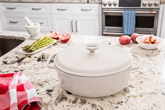 Lodge 7 Quart Enameled Cast Iron Oval Dutch Oven with Lid – Dual Handles – Oven Safe up to 500° F or on Stovetop - Use to Marinate, Cook, Bake, Refrigerate and Serve – Oyster White